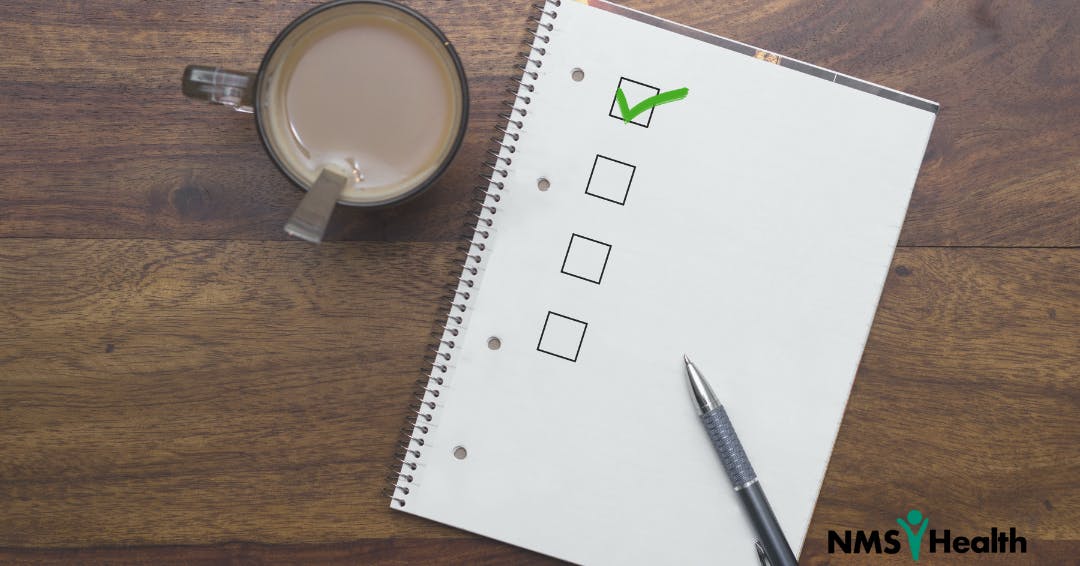 Checklist next to cup of coffee